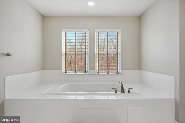 bathroom featuring a bath
