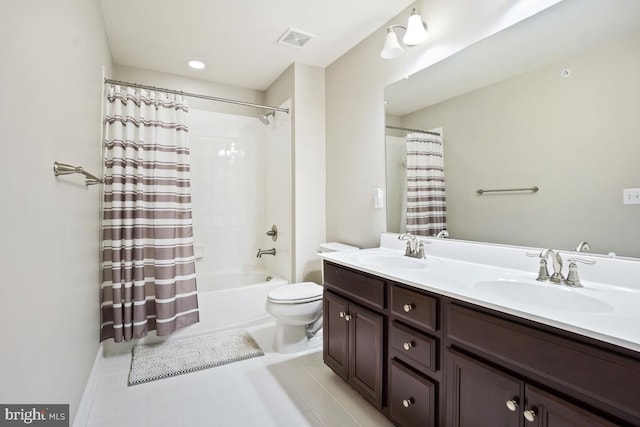 bathroom with a sink, visible vents, toilet, and double vanity