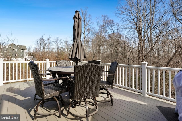wooden deck featuring outdoor dining space