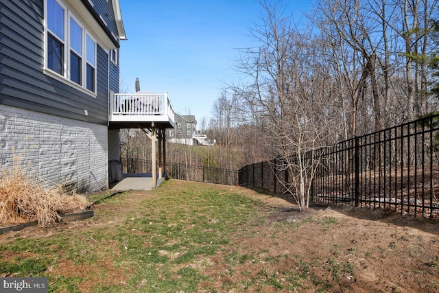 view of yard featuring a fenced backyard and a wooden deck