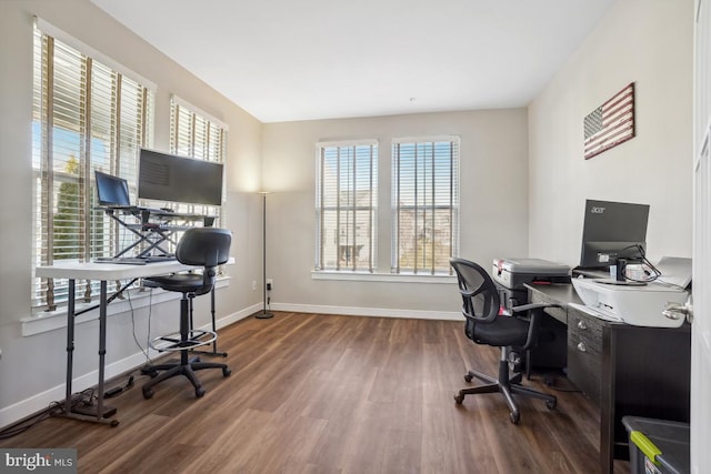 office space with baseboards and wood finished floors