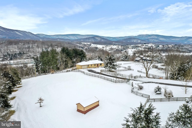 snowy aerial view with a mountain view