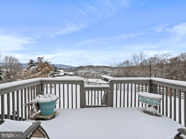 view of snow covered deck