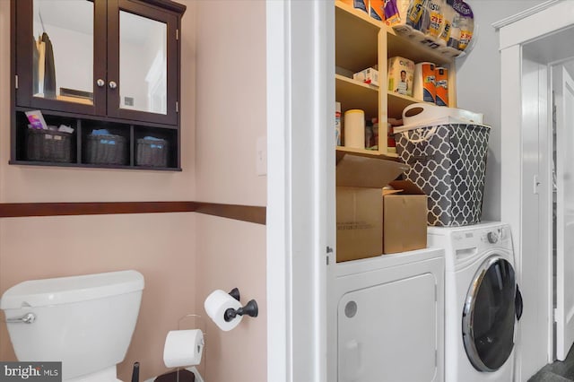 clothes washing area featuring washing machine and dryer