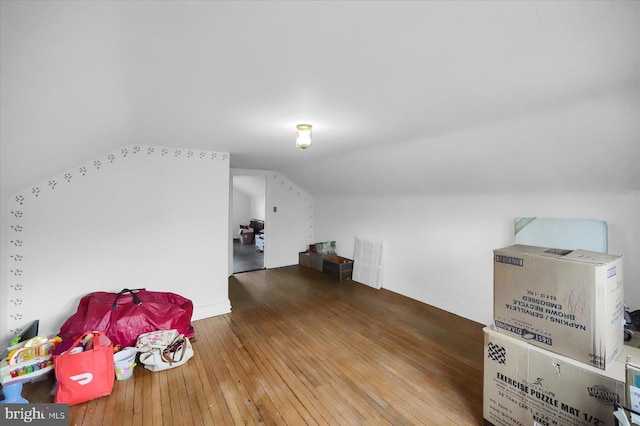 bonus room featuring hardwood / wood-style floors and vaulted ceiling