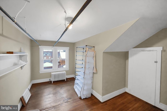 bonus room featuring radiator and dark hardwood / wood-style floors