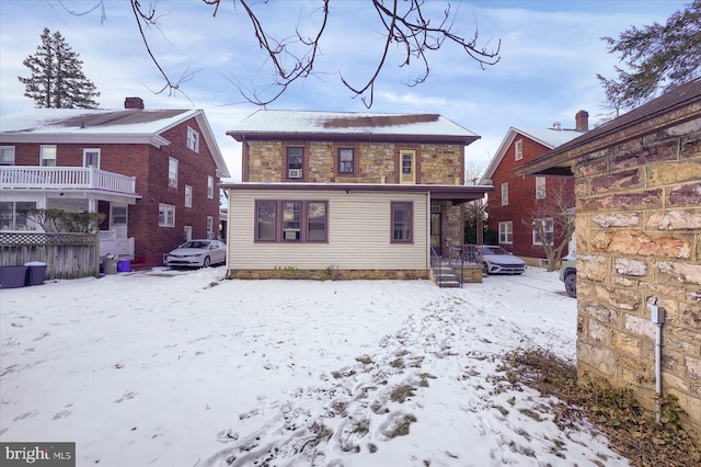 view of snow covered house