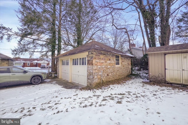 view of snow covered garage