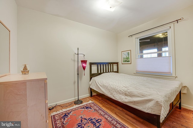 bedroom featuring hardwood / wood-style flooring