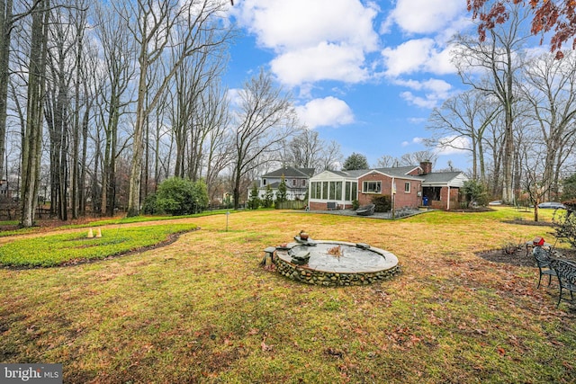 view of yard featuring a sunroom