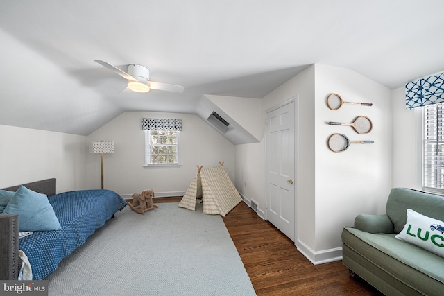 bedroom with ceiling fan, dark hardwood / wood-style flooring, and vaulted ceiling