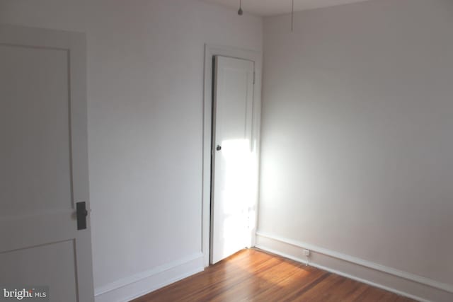 unfurnished room featuring hardwood / wood-style floors