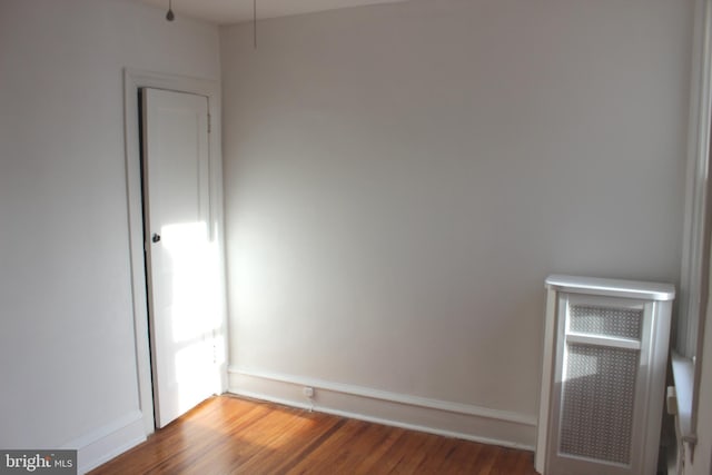 spare room with hardwood / wood-style floors