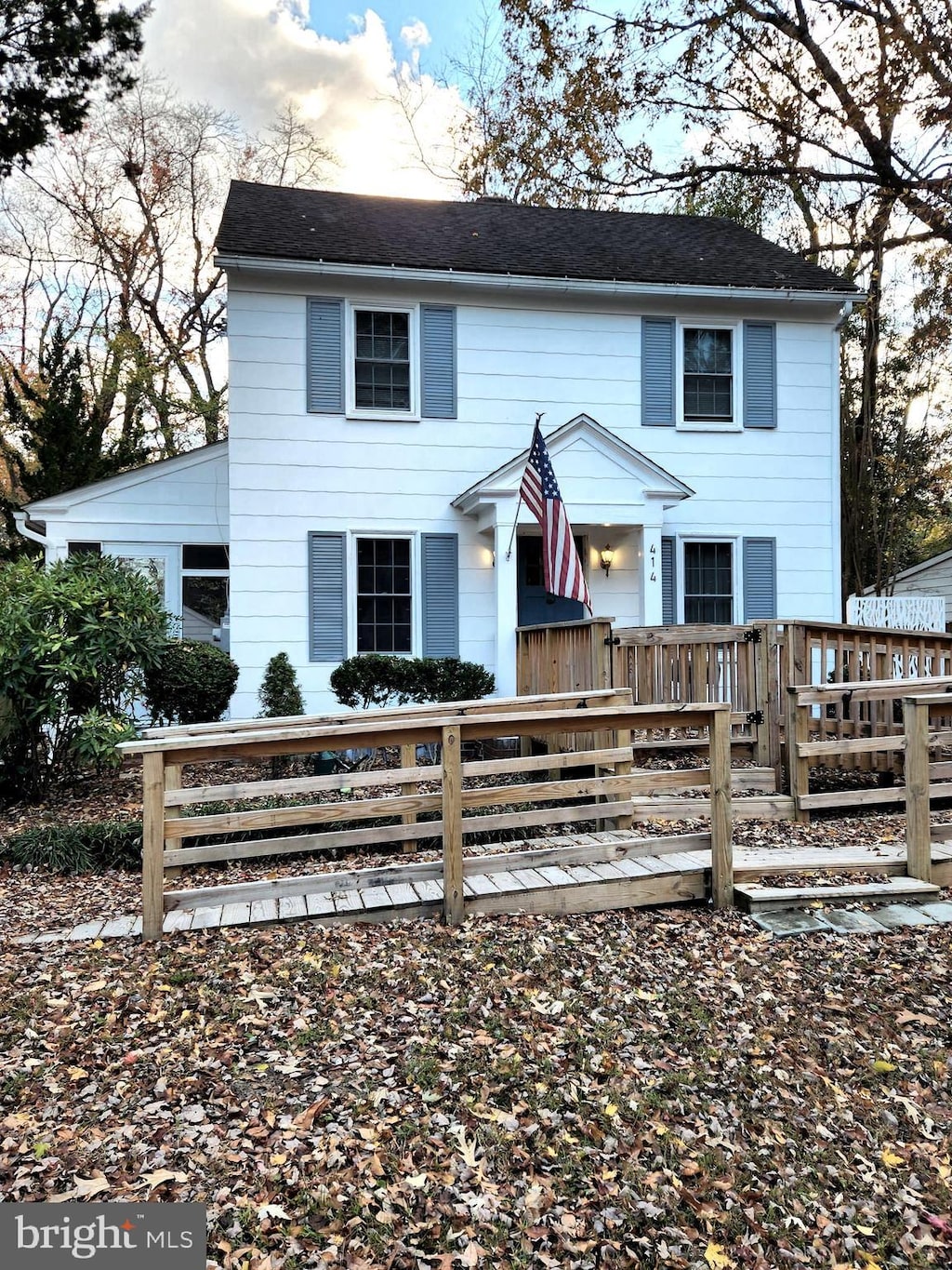 view of front of property with a wooden deck