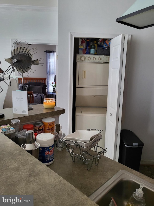 kitchen featuring stacked washer / drying machine