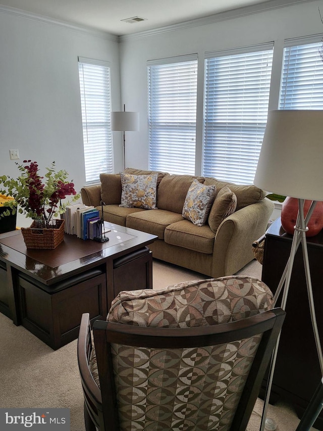 living room with crown molding and light colored carpet