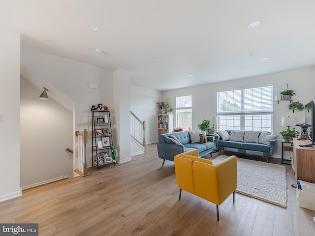 living room with light hardwood / wood-style flooring