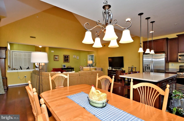 dining room with dark hardwood / wood-style flooring, a notable chandelier, and lofted ceiling