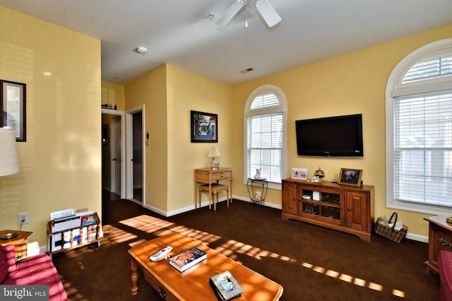 carpeted living room featuring ceiling fan