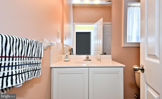 bathroom featuring vanity and toilet