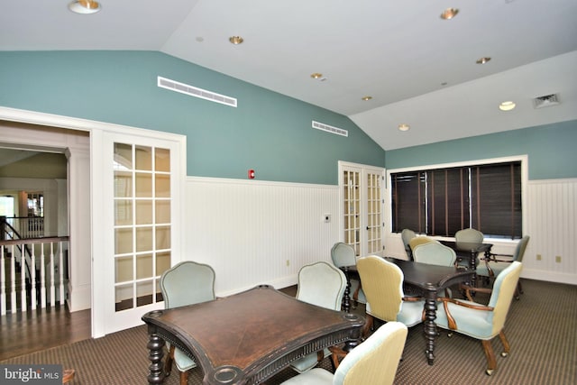 dining room featuring vaulted ceiling and french doors