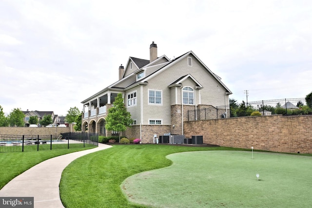 view of home's community featuring a yard