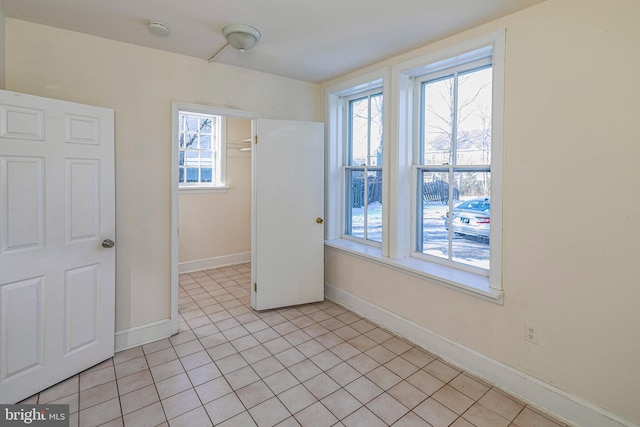 empty room with light tile patterned floors