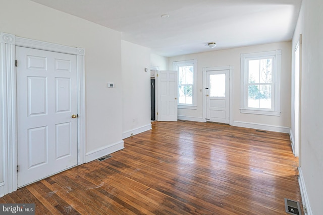 foyer featuring dark wood-type flooring