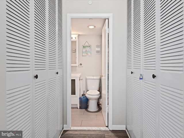 bathroom with tile patterned flooring and toilet