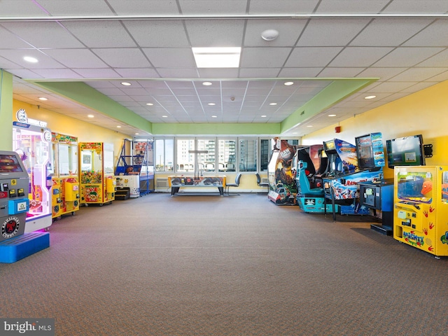 game room with a drop ceiling