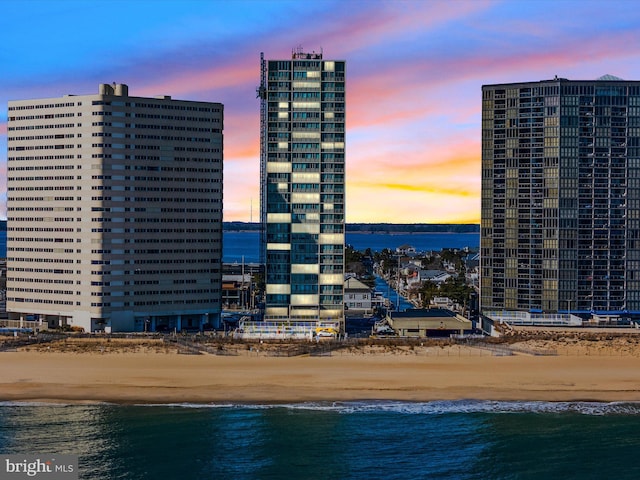 exterior space featuring a view of the beach and a water view