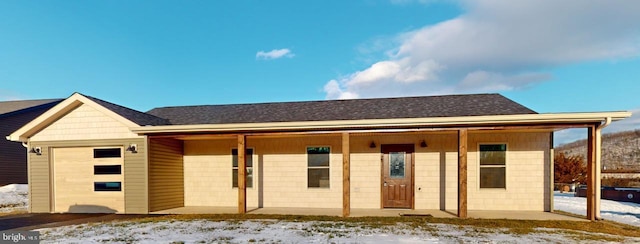 ranch-style house featuring a garage