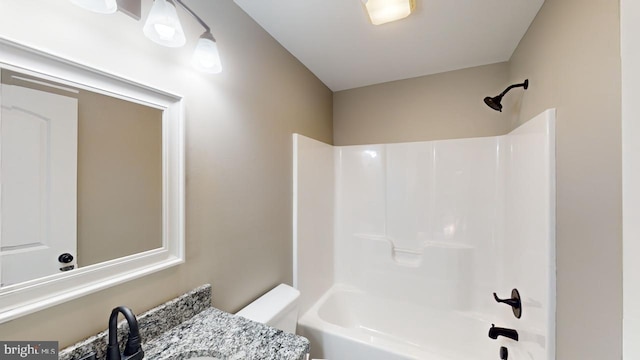 full bathroom featuring  shower combination, toilet, and vanity