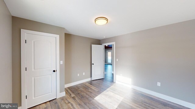 unfurnished bedroom with light wood-type flooring