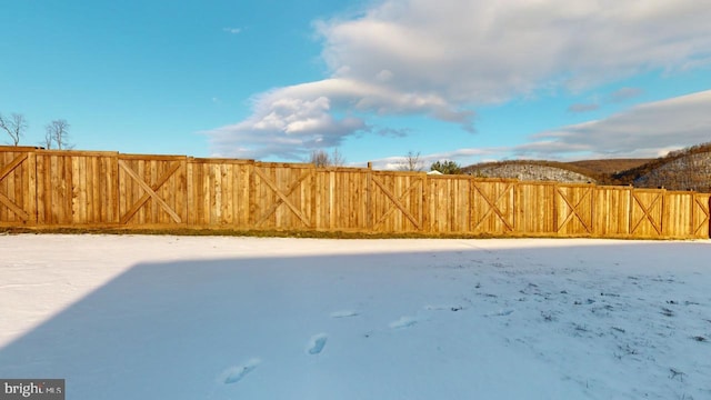 view of yard covered in snow