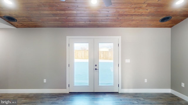 doorway with dark hardwood / wood-style floors, vaulted ceiling, wooden ceiling, and french doors