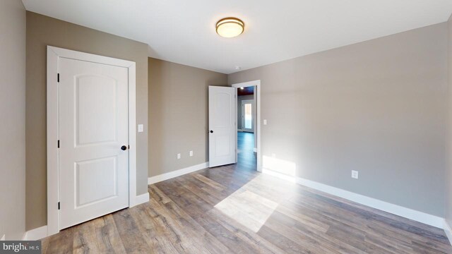 unfurnished bedroom featuring light wood-type flooring