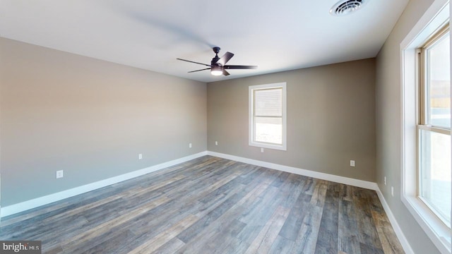 empty room featuring dark hardwood / wood-style floors and ceiling fan