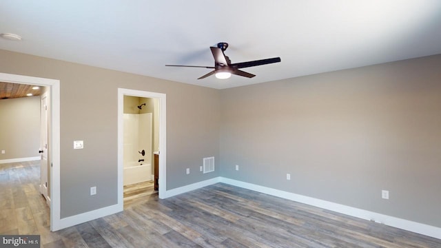 unfurnished bedroom featuring wood-type flooring, ceiling fan, and ensuite bathroom