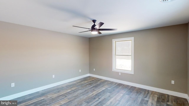 spare room featuring hardwood / wood-style flooring and ceiling fan