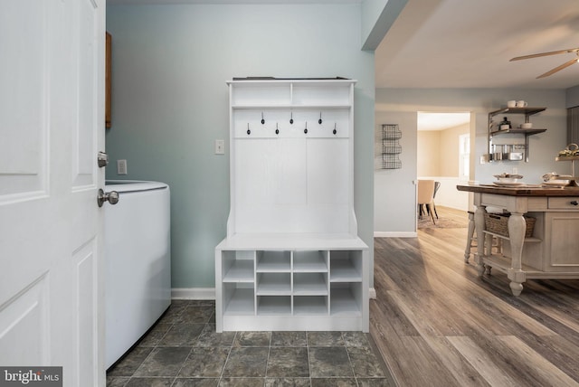 mudroom featuring washer / clothes dryer, dark hardwood / wood-style floors, and ceiling fan