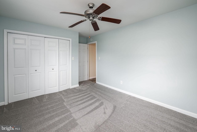 unfurnished bedroom with a closet, ceiling fan, and carpet