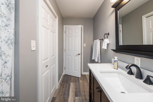 bathroom featuring vanity and wood-type flooring