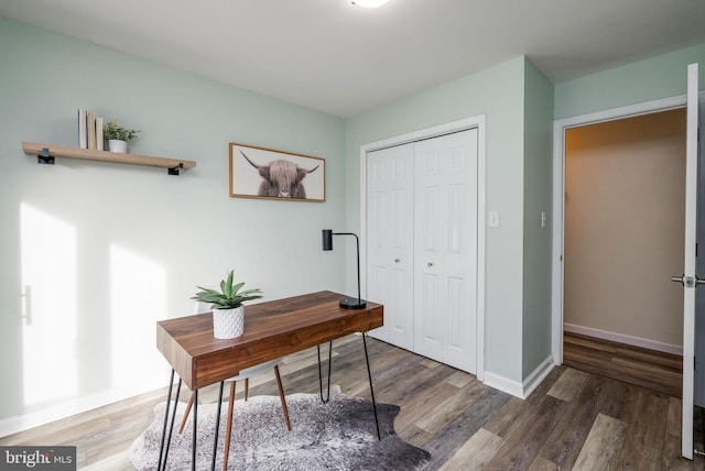 home office featuring dark hardwood / wood-style flooring