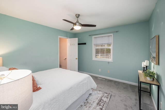 bedroom featuring ceiling fan and light carpet