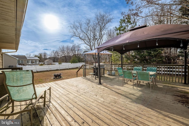 deck featuring a grill and a gazebo