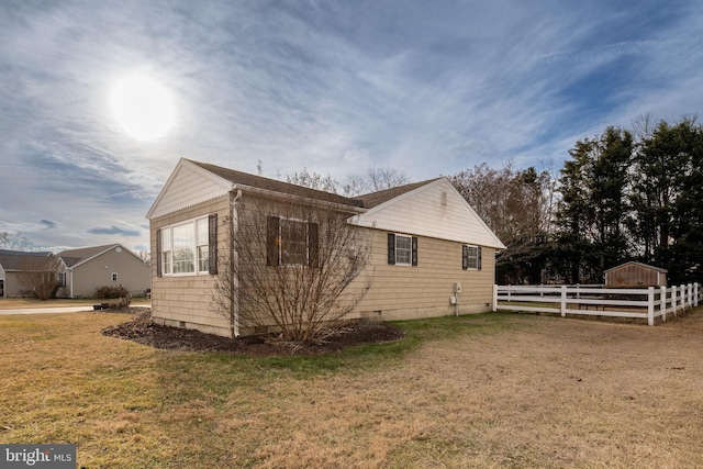 view of property exterior with a yard