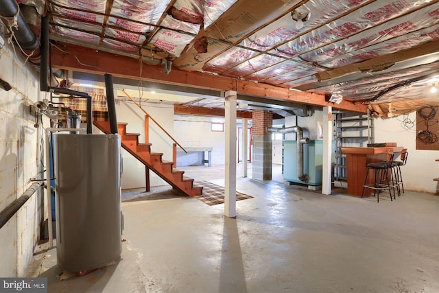 basement featuring heating unit and water heater