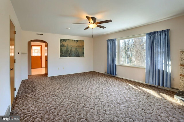 spare room featuring carpet floors and ceiling fan