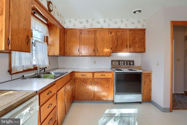 kitchen featuring sink and white appliances